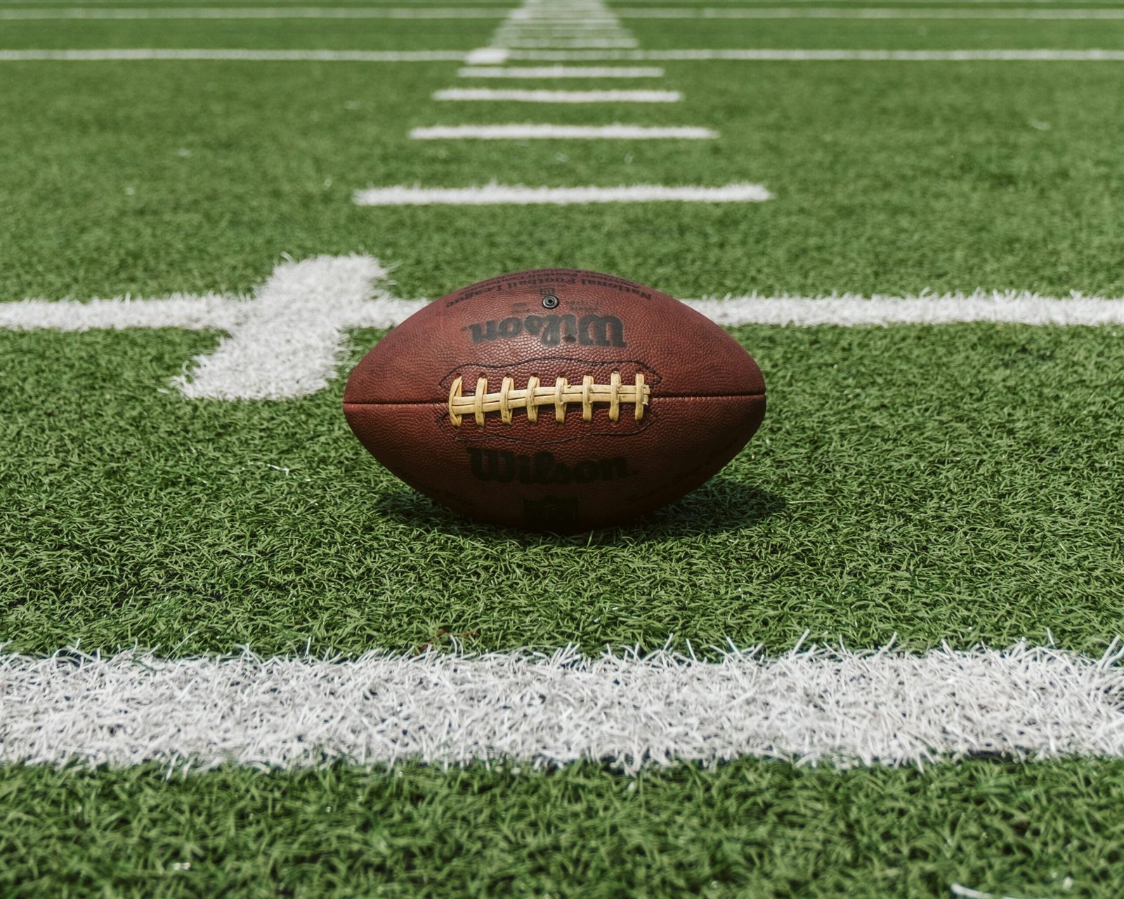 NFL preseason football game with players preparing for kickoff during the opening matchup.
